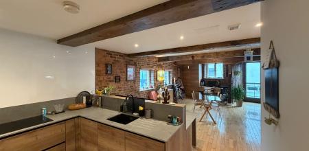 View from kitchen to dining area and Juliet balcony 