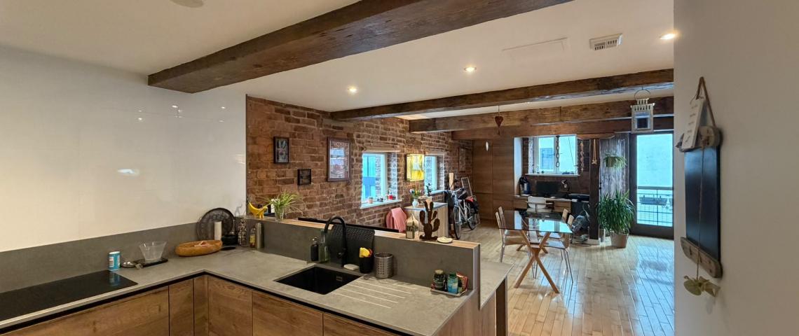 View from kitchen to dining area and Juliet balcony
